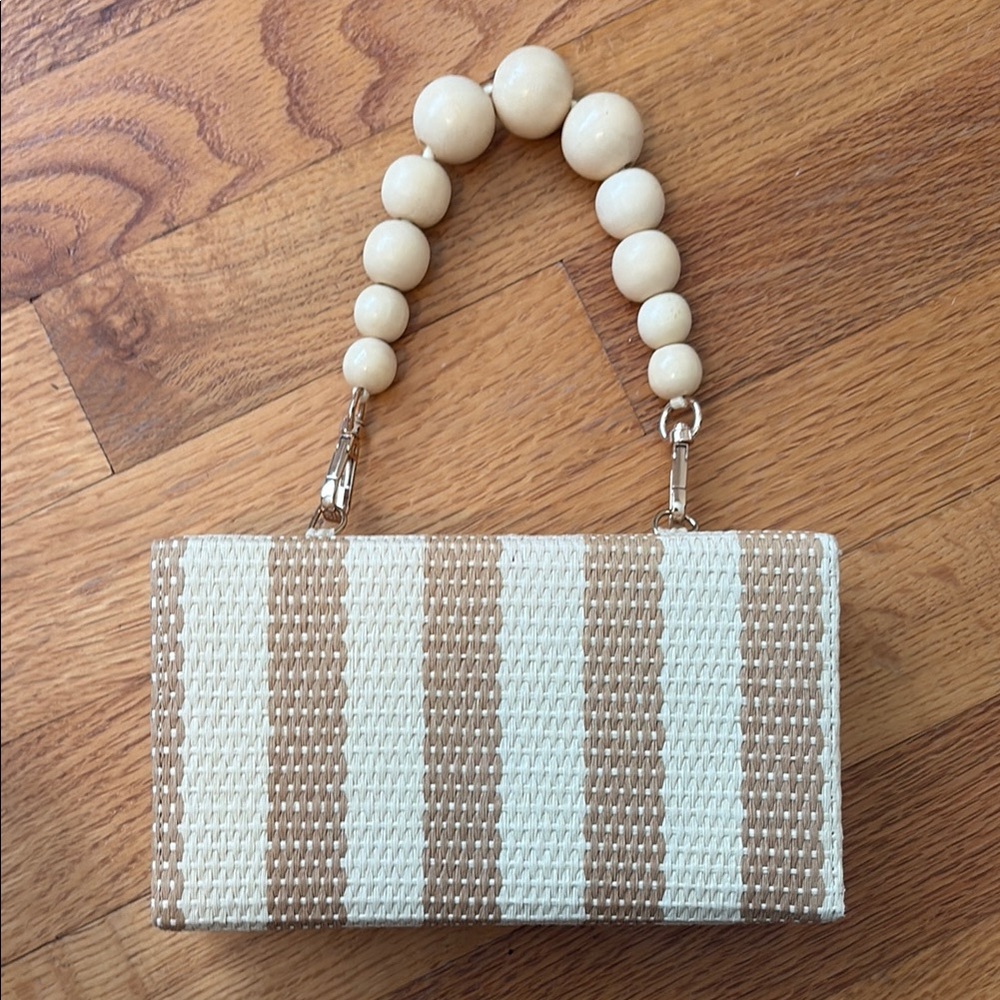 A New Day Cream and Tan Clutch with Striped Design